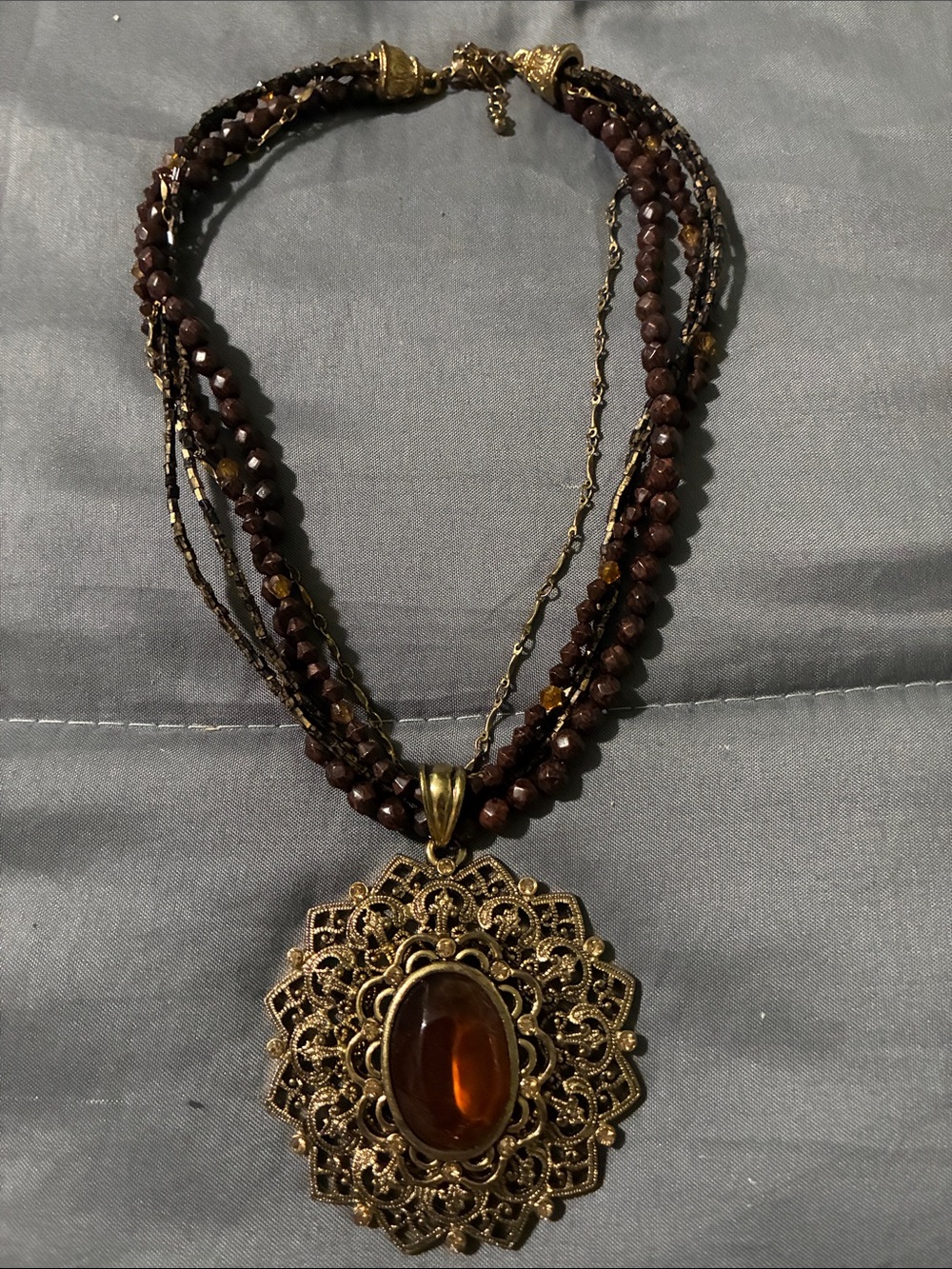 Gold Filigree Pendant Necklace with Amber Center and Brown Beads